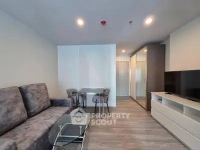 Modern living room with sleek furniture and stylish decor in a contemporary apartment.