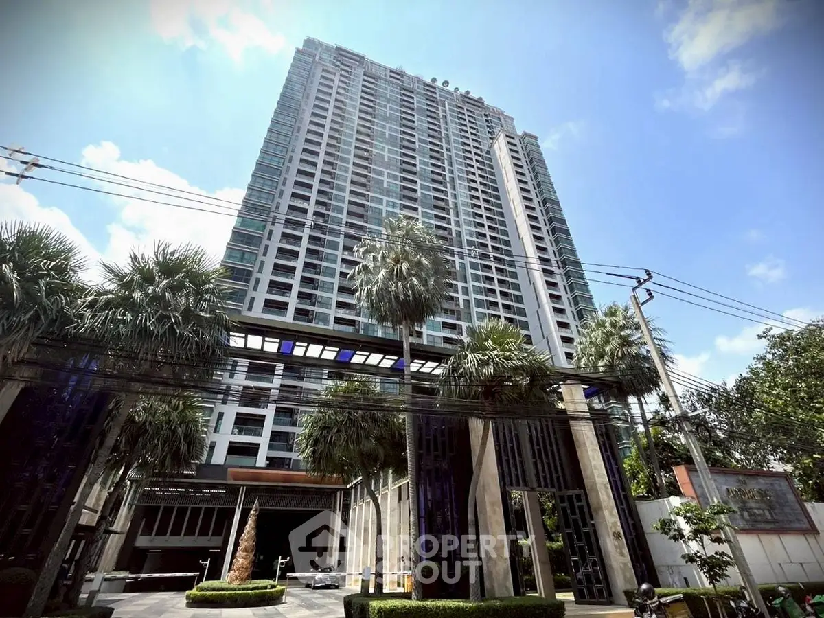 Stunning high-rise building with lush landscaping and modern architecture.