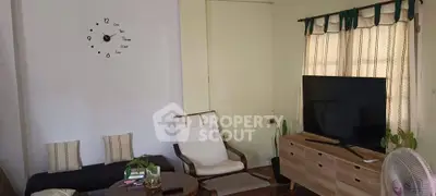 Cozy living room with modern decor and large TV setup