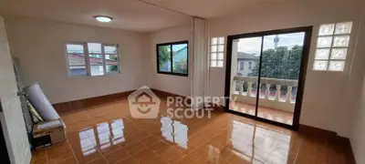Spacious empty room with large windows and balcony access, perfect for customization.