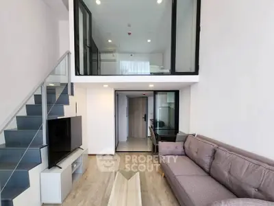 Modern loft apartment with stylish living room and mezzanine level