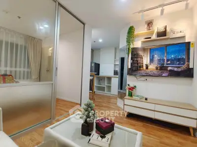 Modern living room with wooden flooring, stylish decor, and city view from window.