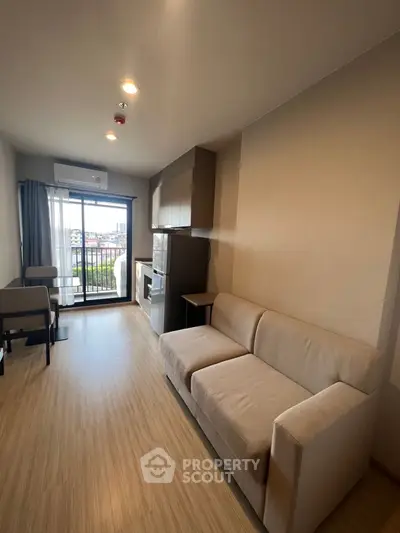 Modern living room with cozy sofa and balcony view in stylish apartment