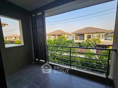 Spacious balcony with scenic neighborhood view, perfect for relaxation and outdoor enjoyment.