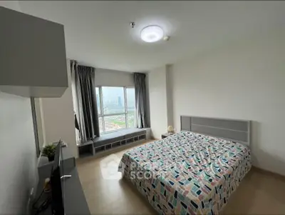 Spacious bedroom with city view and modern decor