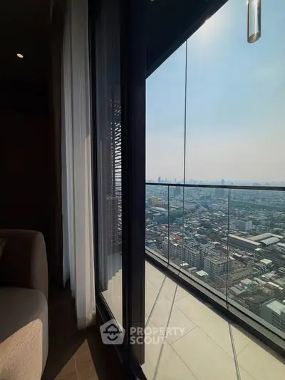 Stunning high-rise balcony view overlooking the city skyline, perfect for urban living enthusiasts.