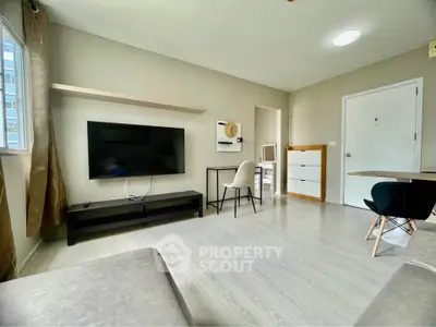 Modern living room with sleek TV setup and stylish furniture