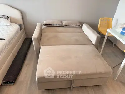 Modern bedroom with convertible sofa bed and stylish decor