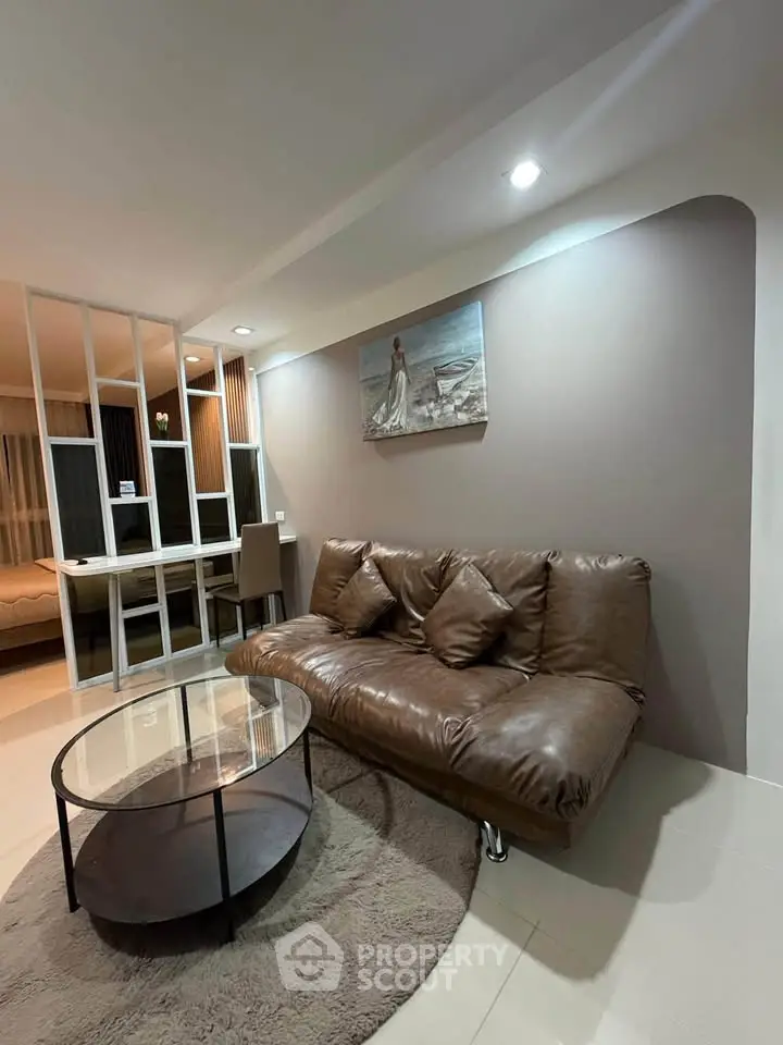 Modern living room with brown leather sofa and stylish decor