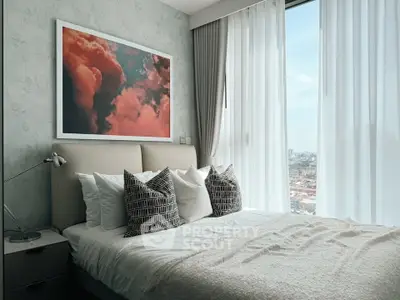 Modern bedroom with large window and stylish decor in a high-rise apartment.