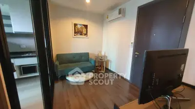 Cozy living room with modern decor and air conditioning in a stylish apartment.