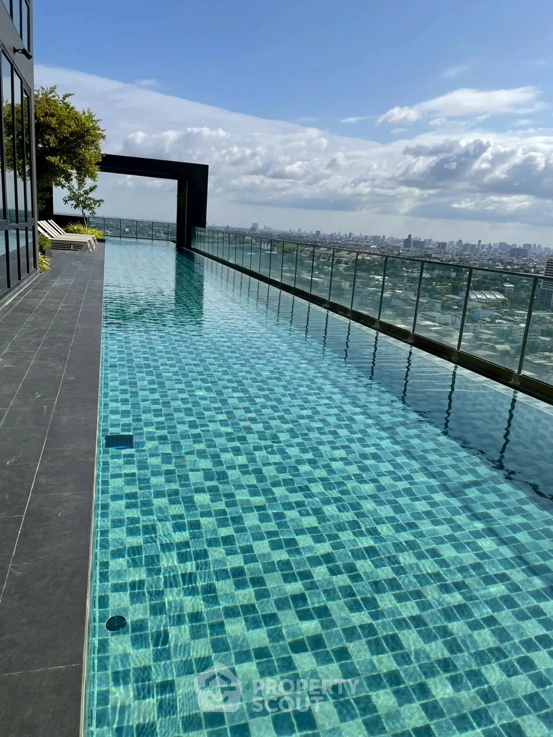 Luxurious rooftop infinity pool with stunning city skyline view