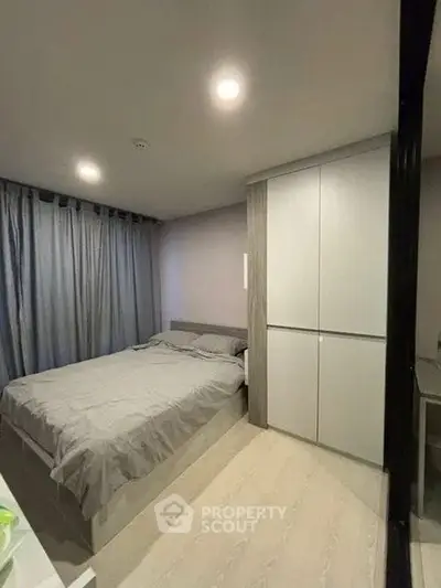 Cozy bedroom with modern decor and ample storage space