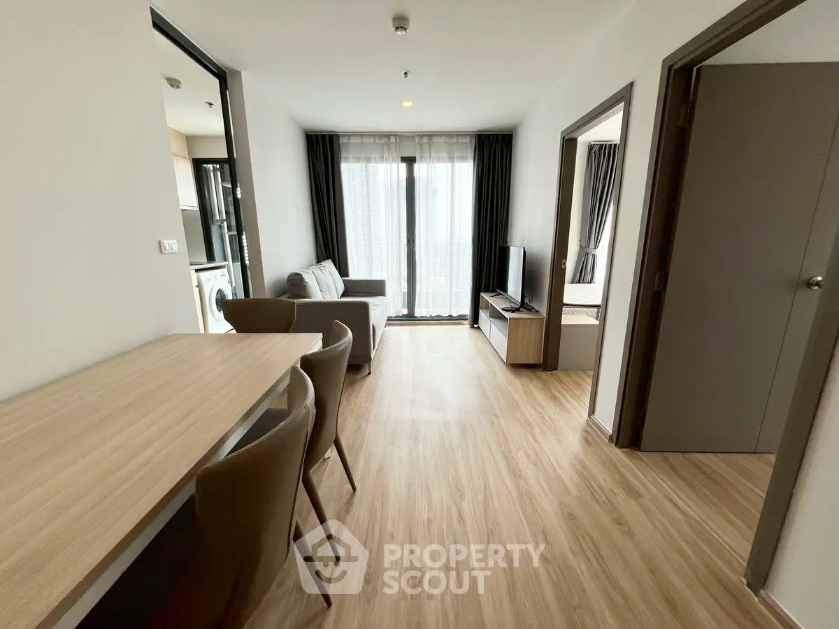 Modern living room with wooden flooring and natural light