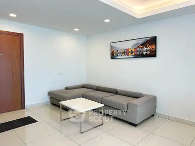 Modern living room with sleek gray sofa and minimalist decor