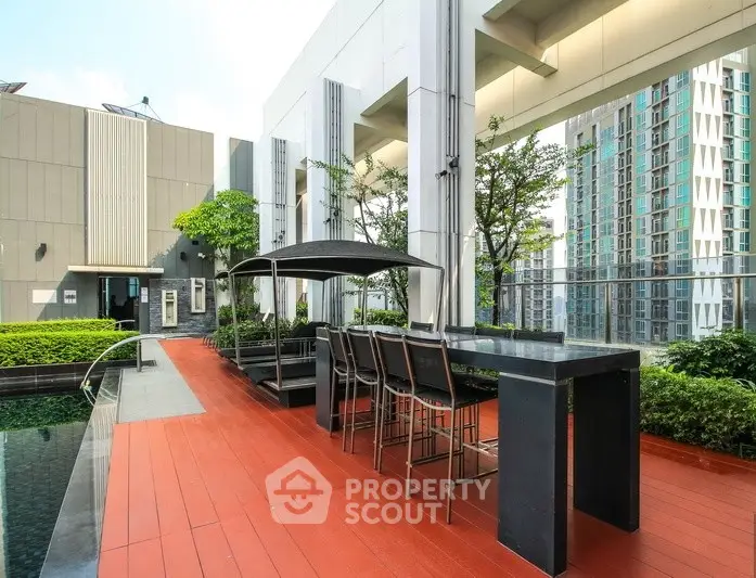Luxurious rooftop pool area with modern seating and stunning city views.