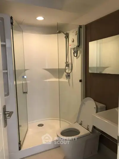 Modern bathroom with glass shower and sleek fixtures