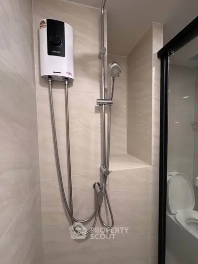 Modern bathroom with sleek shower unit and glass enclosure