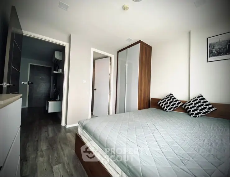 Modern bedroom with stylish decor and ample natural light