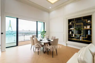 Luxurious dining area with stunning river view and elegant decor