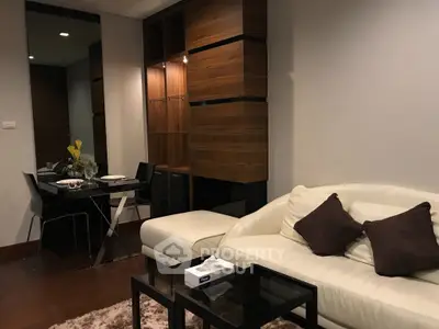 Modern living room with cozy sofa and elegant dining area