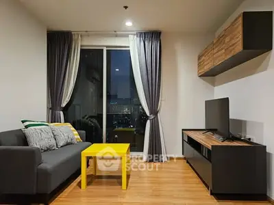 Modern living room with stylish decor and city view, featuring a cozy sofa and vibrant yellow table.