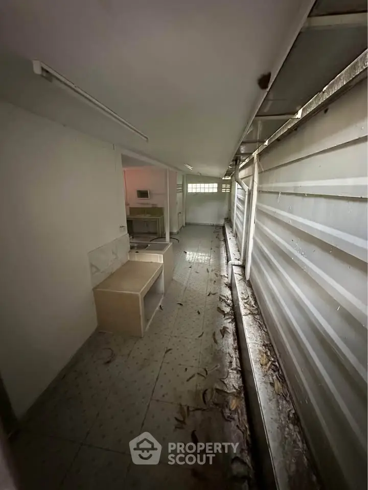 Spacious storage area with natural light and potential for customization.