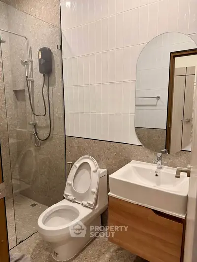 Modern bathroom with glass shower and sleek fixtures