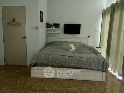 Cozy bedroom with modern decor and natural light