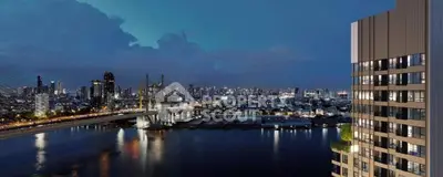 Stunning cityscape view from high-rise apartment overlooking river and bridge at dusk.