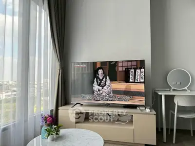 Modern living room with TV, elegant curtains, and stylish decor