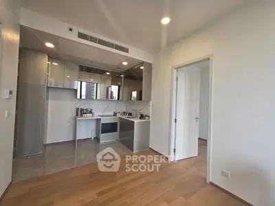 Modern kitchen with sleek cabinetry and open layout in a bright apartment