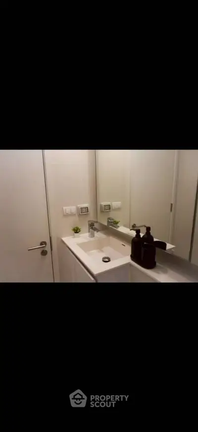 Modern bathroom with sleek sink and mirror design