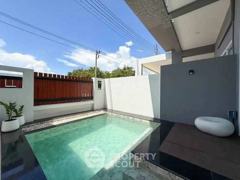 Modern home with private pool and stylish outdoor area, perfect for relaxation.