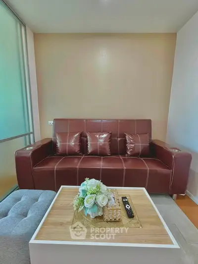 Stylish living room with modern leather sofa and elegant decor