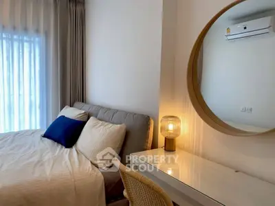 Cozy bedroom with modern decor and soft lighting