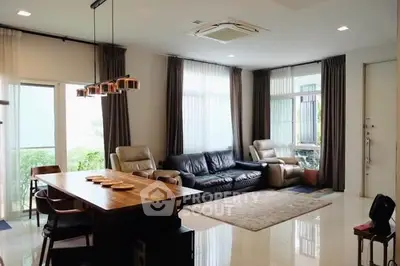 Spacious living room with modern furniture and large windows