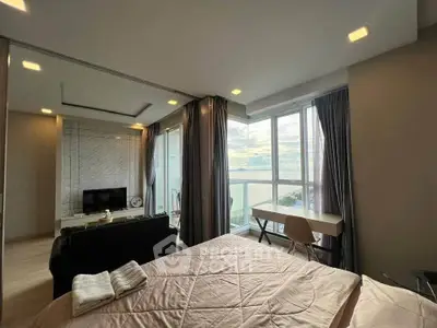 Luxurious bedroom with stunning view and modern decor, featuring a cozy bed and elegant furnishings.