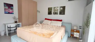 Spacious bedroom with modern decor and cozy ambiance