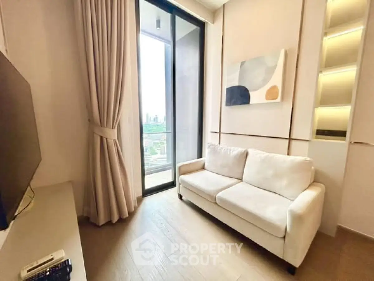Modern living room with city view, elegant decor, and cozy white sofa.
