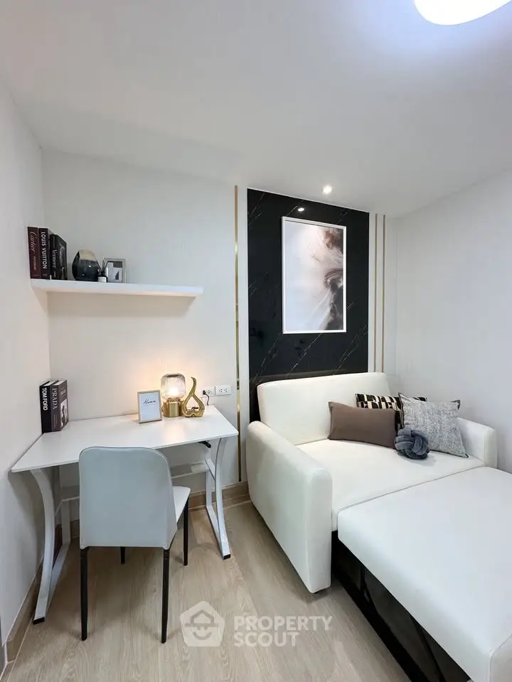 Modern living room with sleek white sofa and stylish decor