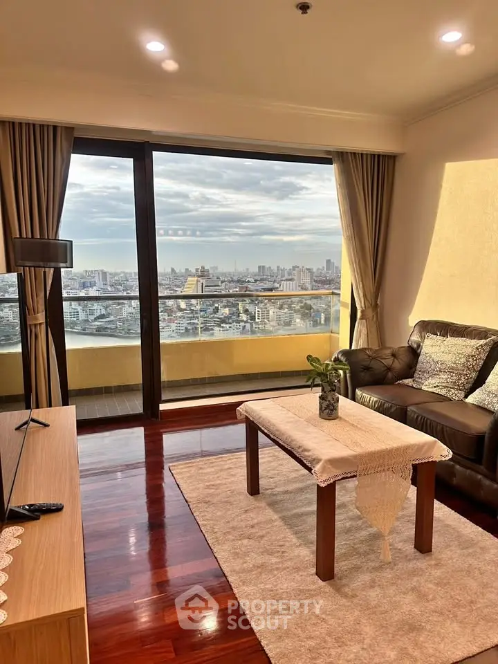Spacious living room with stunning city view and elegant decor