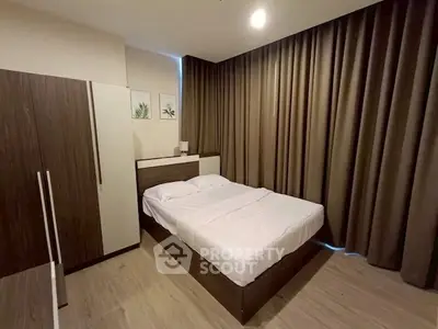 Cozy bedroom with modern design and floor-to-ceiling curtains