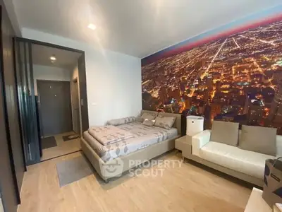 Modern bedroom with cityscape wall art and cozy furnishings