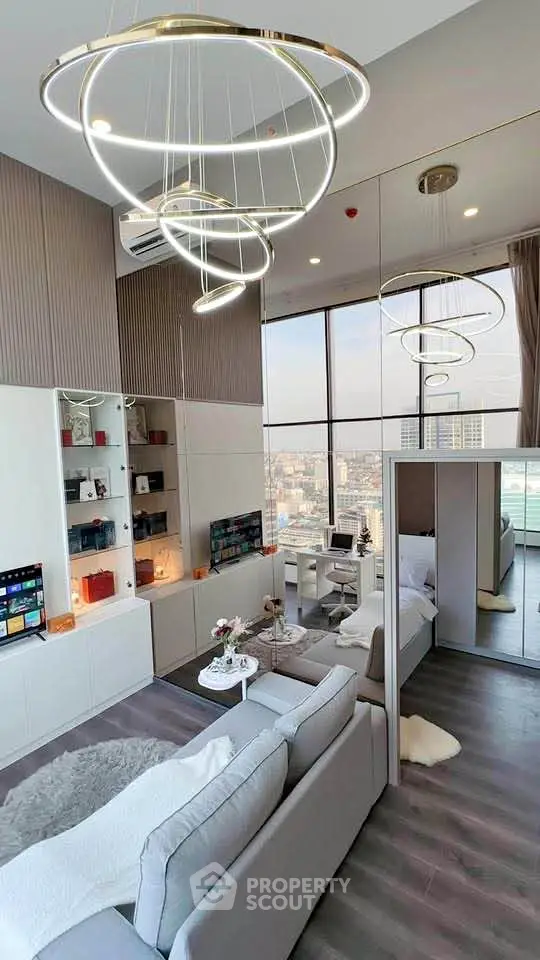 Luxurious modern living room with high ceilings and panoramic city views