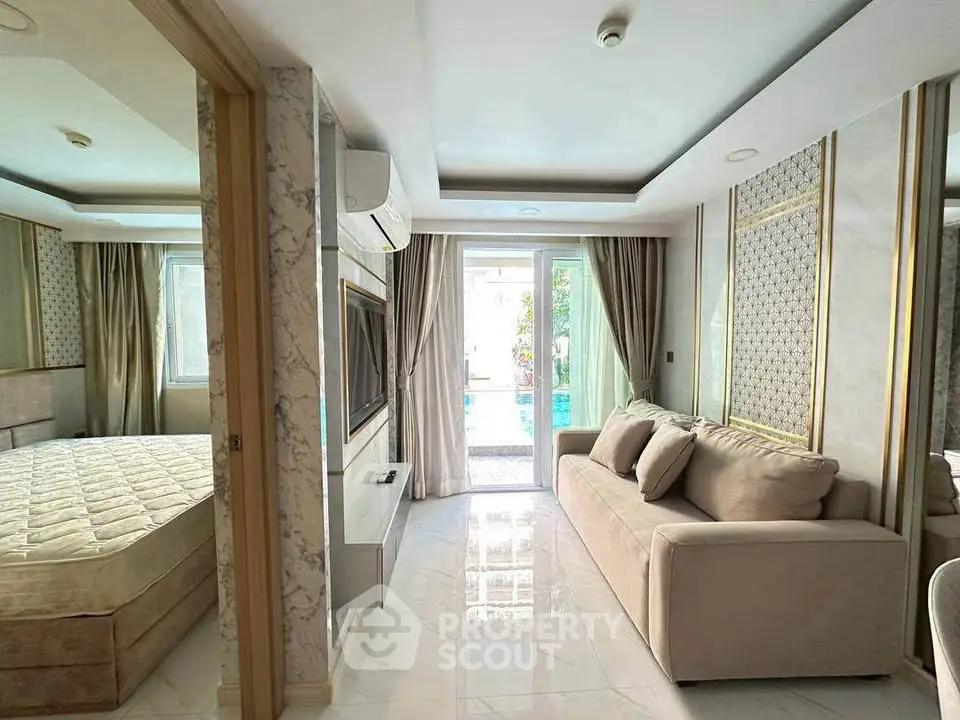 Luxurious living room with pool view, elegant decor, and cozy sofa in modern apartment.