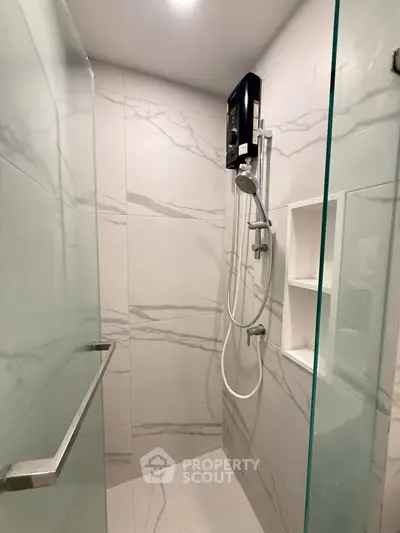 Modern bathroom with sleek shower and marble tiles