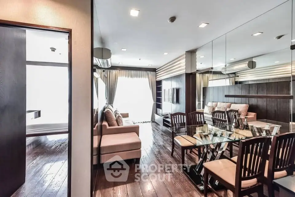 Luxurious modern living room with elegant dining area and plush seating in a stylish apartment.