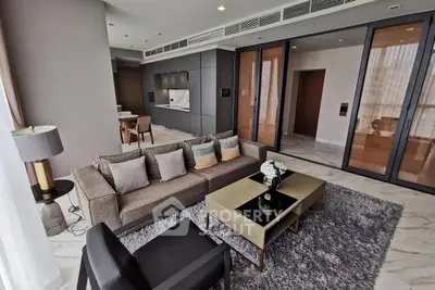 Luxurious modern living room with elegant furniture and open kitchen layout