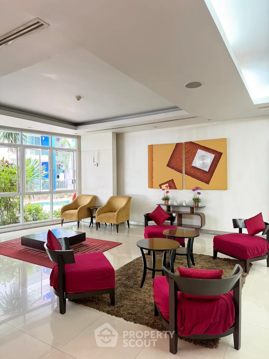 Elegant lobby with modern decor and vibrant seating in a luxurious building